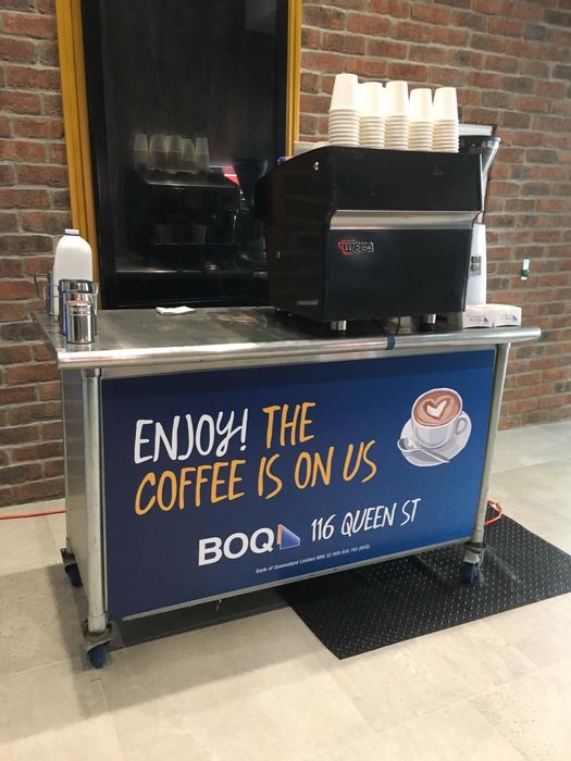 BOQ Bank of Queensland branded mobile espresso cart — 'The Coffee is On Us' at 116 Queen Street Brisbane